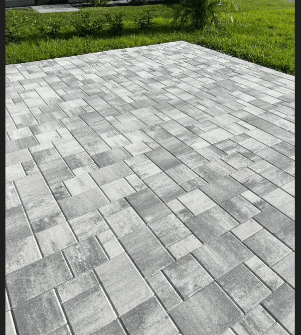Close view of a completed gray paver installation by Creative Edge Outdoor Solutions